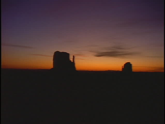 Bold geologic formations rise above the desert floor.