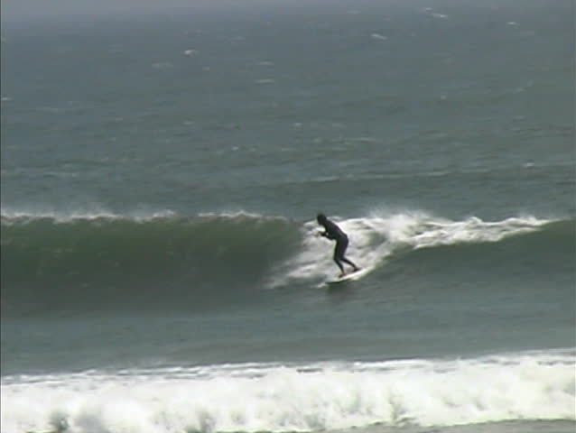 Kiteboarder does flip off of wave