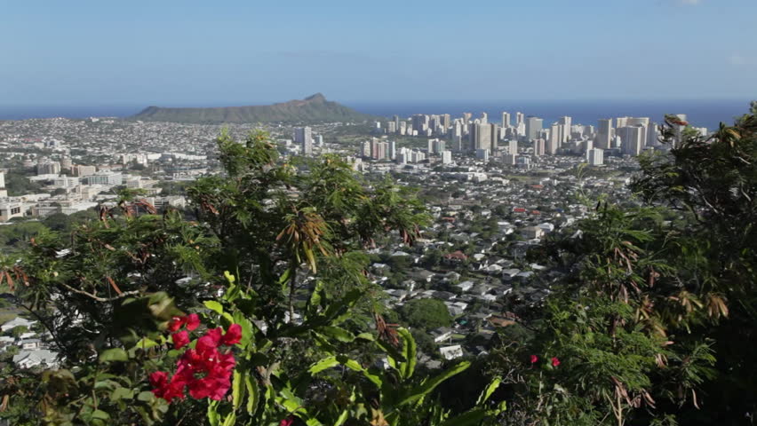 Locked down shot of Honolulu and Waikiki high rises, with Diamond Head in the background; Oahu, Hawaii.