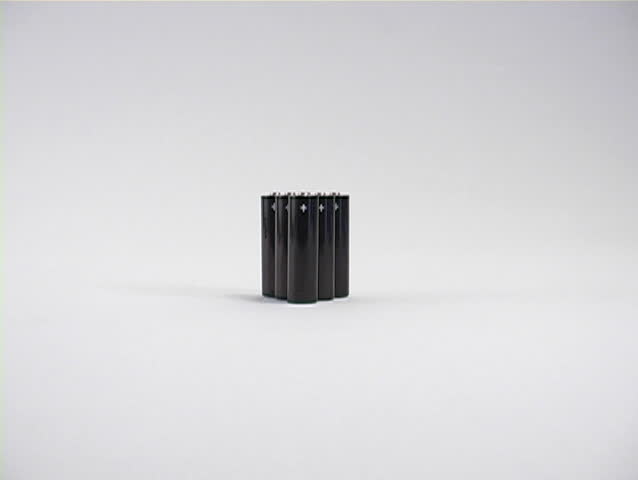 A zoom in to reveal six batteries for a portable electronic device.