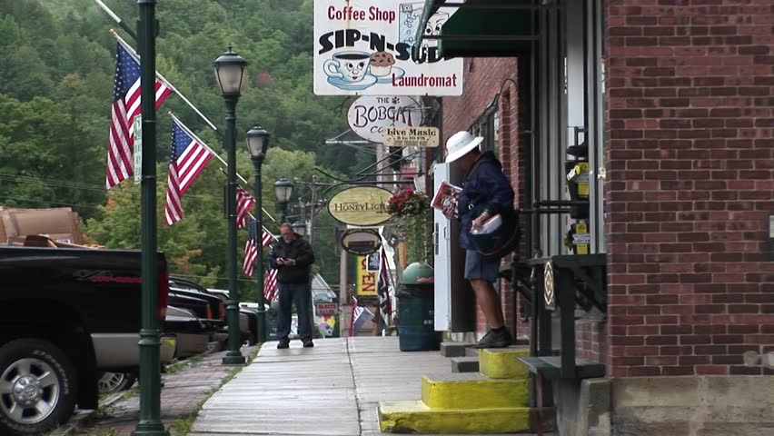 VERMONT - CIRCA 2009: People walk into small downtown stores in Vermont.