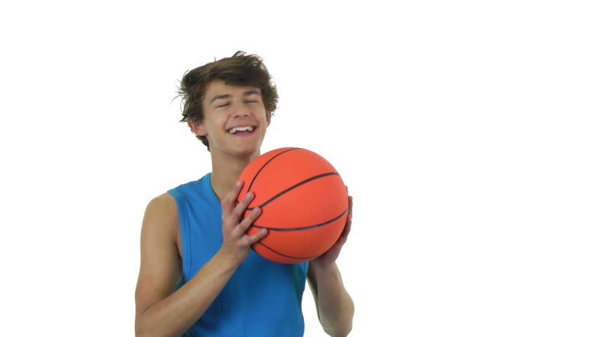 a guy throwing a basketball upwards