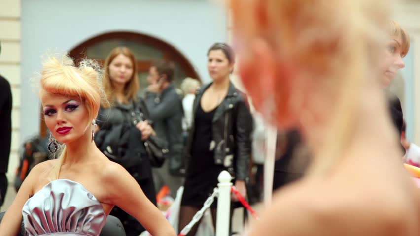 MOSCOW - OCTOBER 2: Blonde model sit in front of mirror at XVII International Festival World of Beauty 2010 in exhibition complex Gostiny Dvor, on October 2, 2010 in Moscow, Russia. 