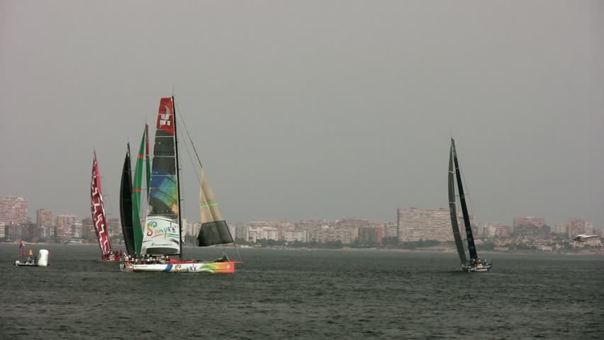 ALICANTE, SPAIN - OCTOBER 7: Sanya and Groupama Team, two of the six teams participating in the race around the world "Volvo Ocean Race 2011-2012" begin their preparation in the first race on Oct 7, 2011 in Alicante Spain. 