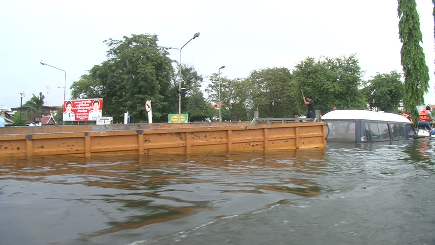 AYUTTHAYA, THAILAND - OCTOBER 12: Floods inundate city residents on October 12, 2011, Ayutthaya, Thailand. Parts of Thailand are now experiencing the worst floods in half a century, as water inundates villages, historic temples, farms, and factories.