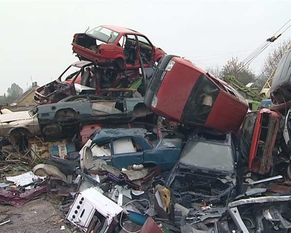 Junkyard full of used car bodies and other metal scrap. 