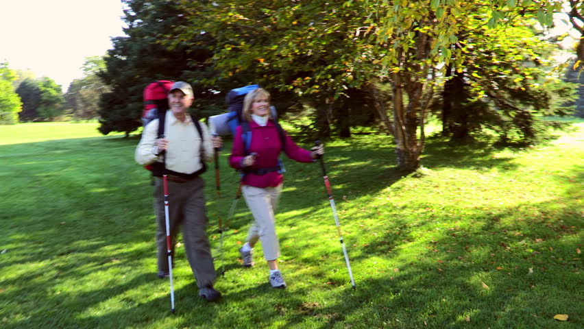Happy senior couple hiking 