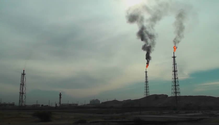 Burning extraction wells in an oil or natural gas field in Iran.