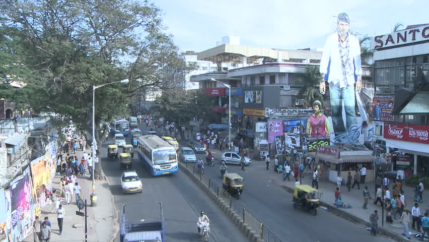 INDIA - CIRCA NOV 2008: Time lapse view of traffic and pedestrians traveling down a busy street circa Nov 2008 in India.