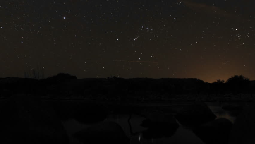 Time lapse of the moonrise and stars setting over the Ventura River in Oak View, California.