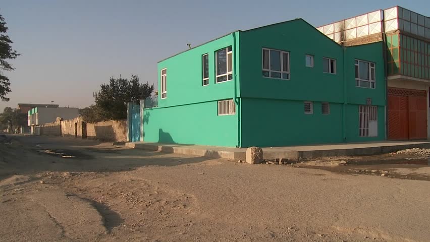KABUL, AFGHANISTAN - CIRCA 2009: Cyclist passes a lonely abandoned neighborhood circa 2009 in Kabul, Afghanistan. Afghanistan is an impoverished and least developed country, one of the world's poorest. 