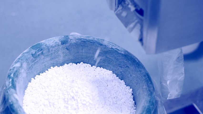 Tablet manufacturing equipment. Pills falling out of pill manufacturing machine. Special Light and air temperature conditions in the room. HD 1080i.
