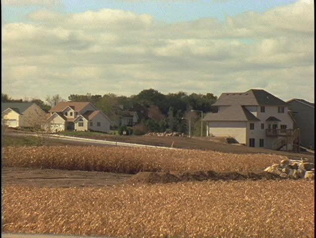 NEBRASKA - CIRCA 1997: A farmer drives through a field of corn circa 1997 in Nebraska.