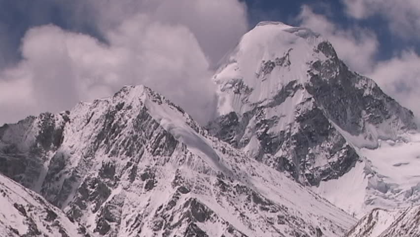 Shot from Everest in Tibet, clouds surrounding Mt. Pumori in Nepal 