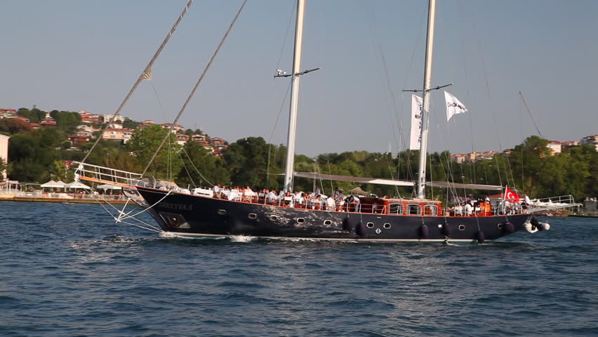ISTANBUL, TURKEY - JULY 31: People travel along Bosporus on July 31 2011 in Istanbul. The Bosphorus is the world's narrowest strait used for international navigation, it connects the Black Sea with the Sea of Marmara  