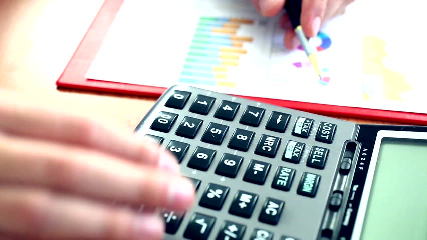 Closeup of businessman hand accounting using a calculator
