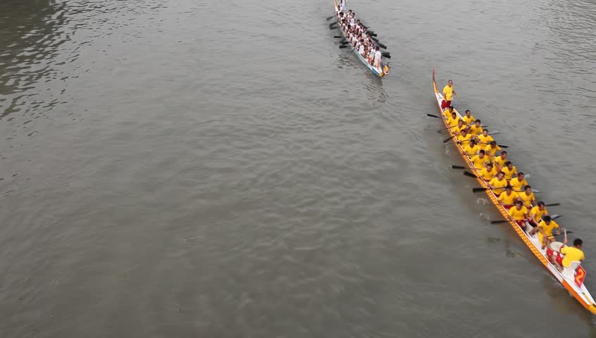 HANGZHOU, CHINA - NOV 5: Participants in action at the FenJiang River Dragon Boat Race on Nov 5, 2011 in Hangzhou, China.