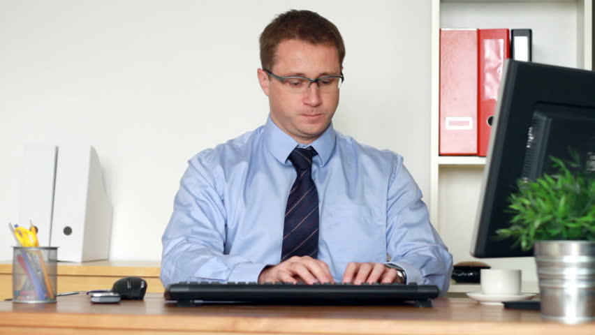 Tired young businessman in the office