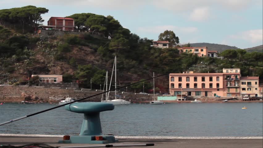 Fishing rod on pier in Porto Azzurro, Elba Island.