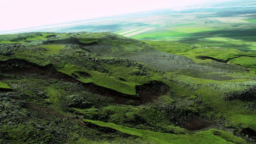 Aerial View of Rugged Icelandic Volcanic Ridges & Grasslands