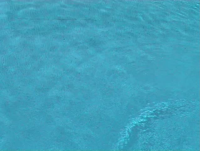 Blue water ripples in swimming pool
