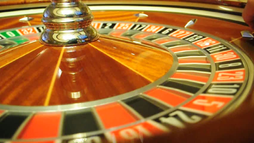 image with a casino roulette wheel with the ball on number 18
