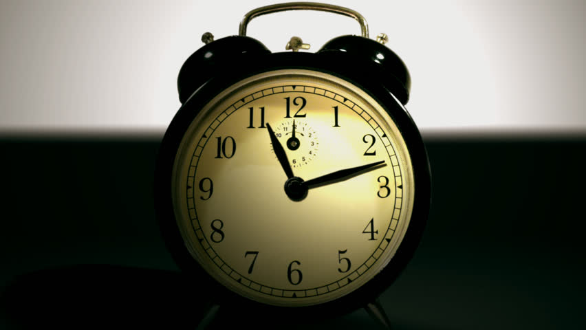 analogue alarm clock going off