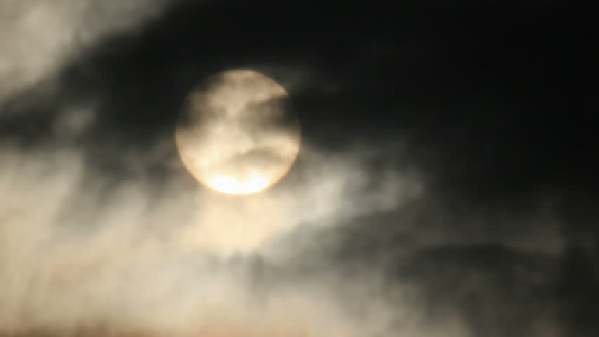 Sunlight behind dark toxic smog