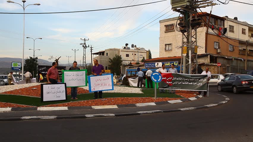 ARABE, ISRAEL - NOV 6, 2010: Men demonstrate in public against domestic violence on November 6, 2010 in Arabe.