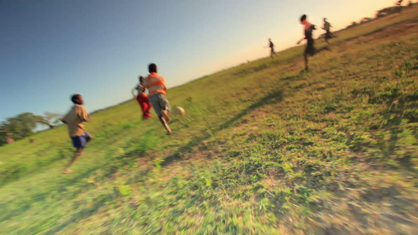 KENYA, AFRICA - CIRCA AUGUST 2010: Shot of children playing soccer on the fields in Kenya, Africa circa August 2010.