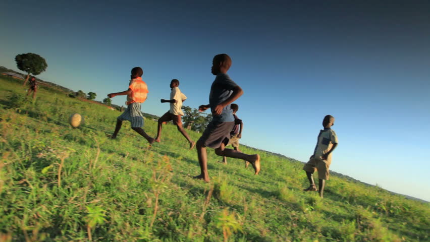 KENYA, AFRICA - CIRCA AUGUST 2010: Children playing soccer on the fields in Kenya, Africa circa August 2010.