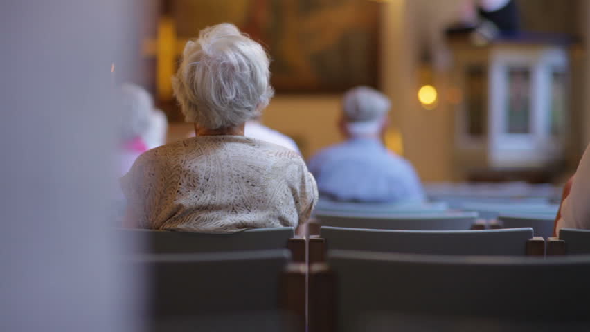 View from behind of people sitting in church in Copenhagen, Denmark
