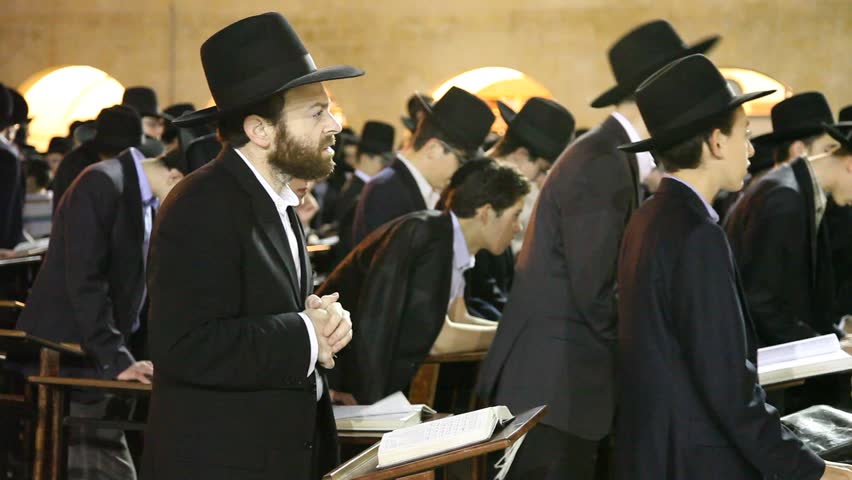 JERUSALEM, ISRAEL - OCT 6, 2011: Yeshiva students pray during Slihot at the Western Wall on October 6, 2011 in Jerusalem.