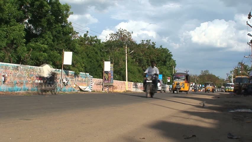 MADURAI, INDIA - CIRCA APRIL 2011: Traffic rushes by circa April 2011 in downtown Madurai.