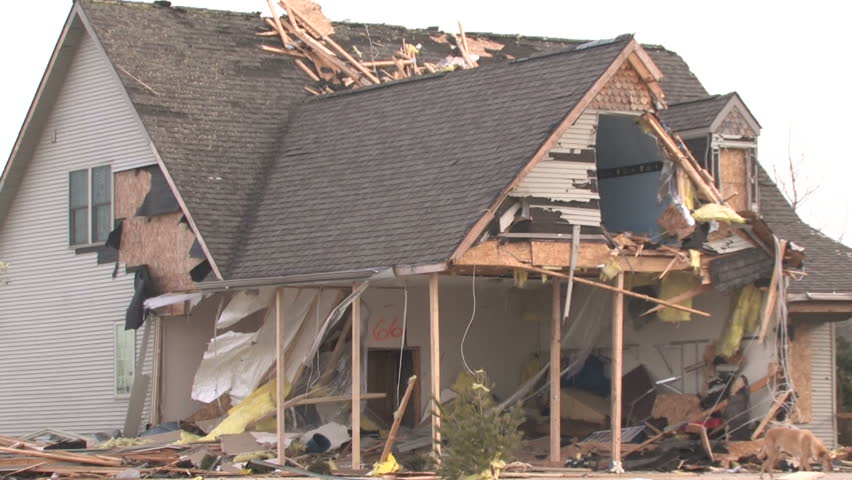 Zooming out from a house that has been destroyed by a tornado. 