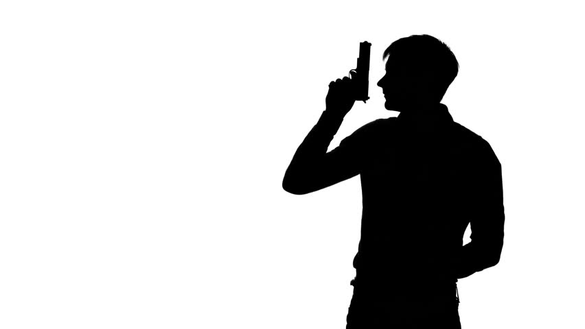Silhouette Of Man's Suicide. He Puts The Gun To His Head, Pulls The