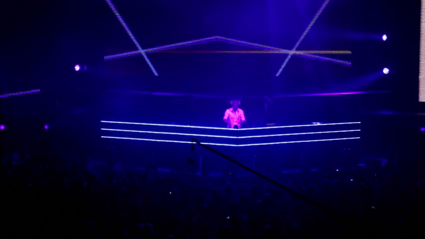 MOSCOW - MAY 6: Popular Dutch DJ Armin Van Buuren on stage at background of video wall, lot of people below on May 6, 2011 in Moscow, Russia.