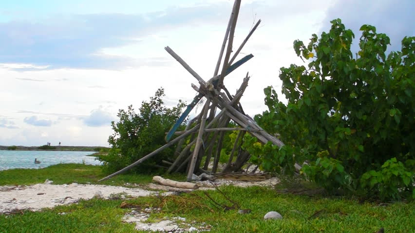 Robinson Crusoe Survival Wood Hut in remote island.