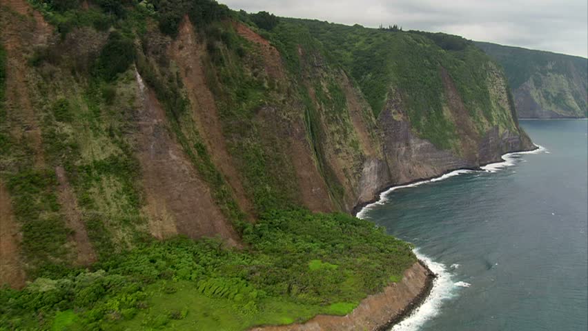 Aerial slow fly by of Hamakua Coast Waterfalls and coastline, Hawaii