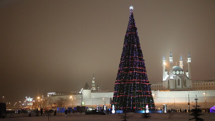 New Year's central Christmas tree near Kazan Kremlin with the view on Kul Sharif Mosque and Soyembika Tower.