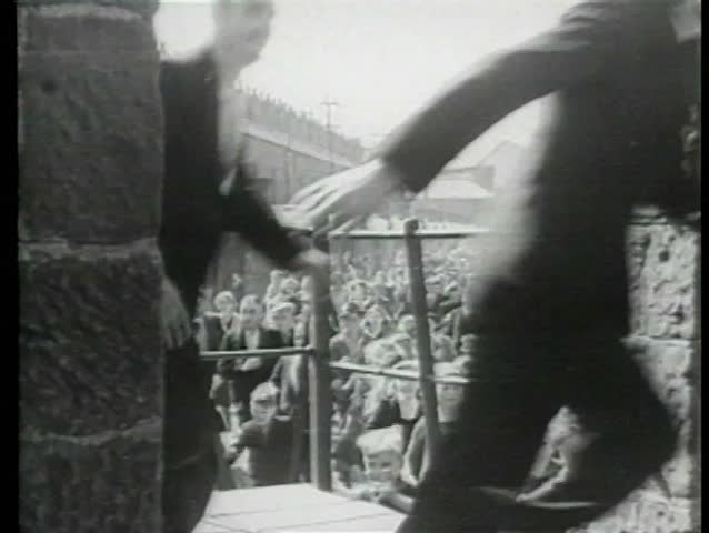 Crowd running through street