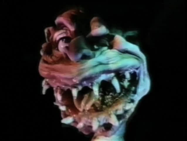 Close-up of toy creature with fangs growling