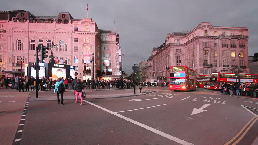 LONDON, UK - DECEMBER 27: Tourists, busses and other traffic on Piccadilly Circus on December 27, 2011 in London, UK. Piccadilly Circus is one of the main entertainment areas of London.