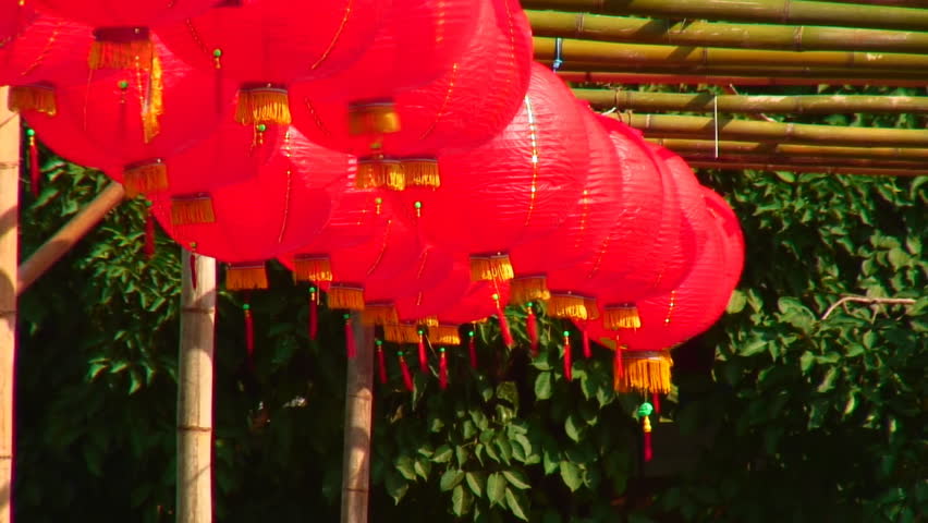 Chinese New Year red lanterns hanging from bamboo 