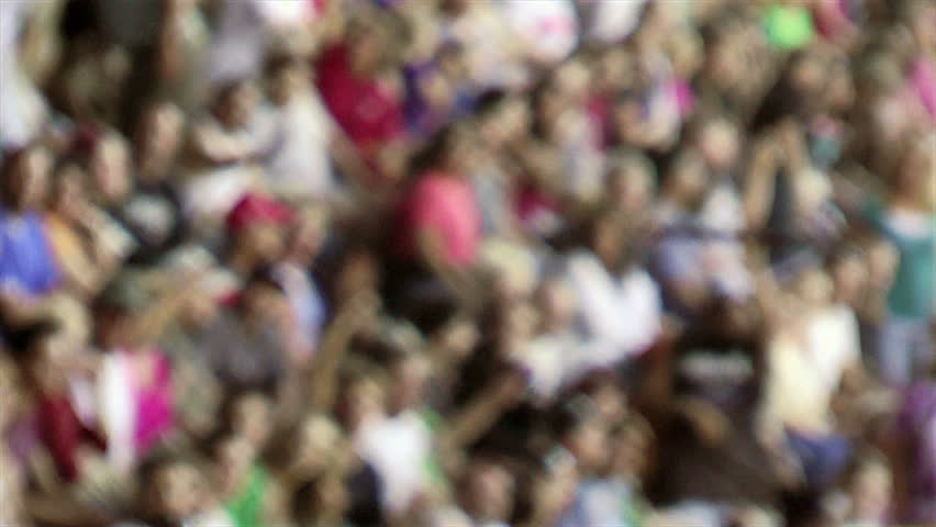Blurred crowd in stands at sporting event