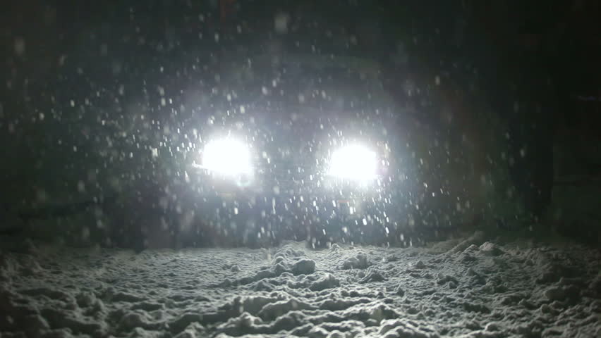 driver and his car in snowstorm
