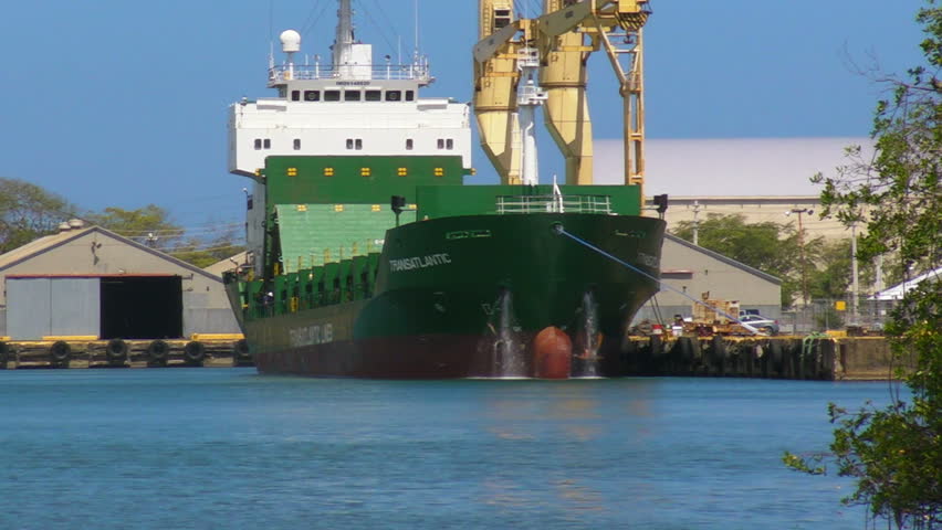 SAN JUAN, PUERTO RICO - JULY 6: Merchant ship flushing decks in San Juan Harbor July 6, 2011.