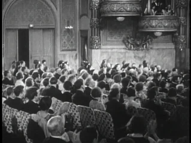 Audience clapping during theatrical performance