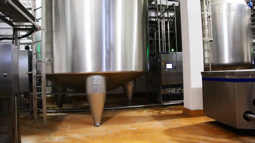 huge steel tank of fresh milk, panorama from bottoom up