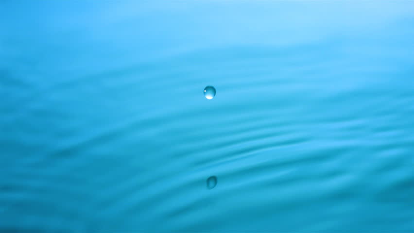 Slow-motion drop hitting water shooting with high speed camera, phantom gold.